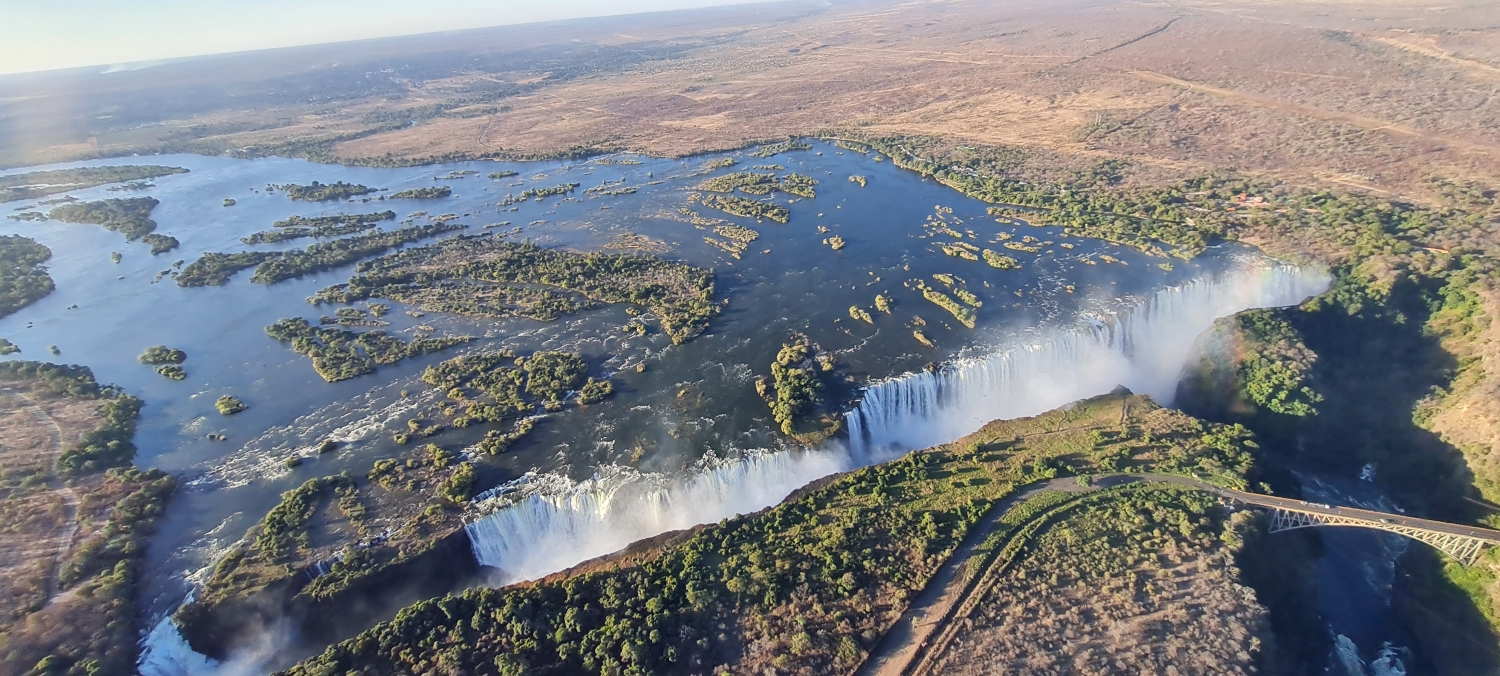 Brian-and-maggie-victoria-falls-helicopter-ride Aerial view of the vast curtain of water of Victoria Falls