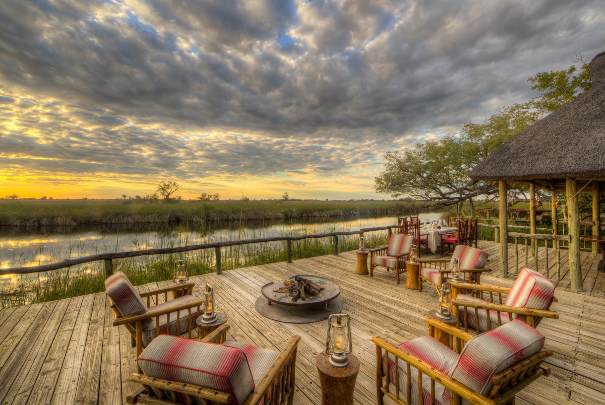 Camp-Xakanaxa-Moremi-Game-Reserve-Botswana-main-area Fire-deck extends over the Khwai River and creates an enchanting environment