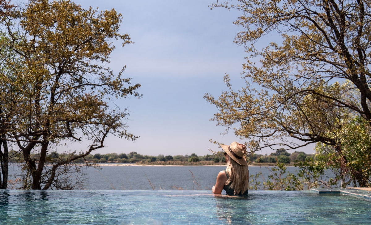 Victoria-Falls-River-Lodge-Zambezi-National-Park-infinity-pool Woman in infinity pool overlooking the Zambezi River