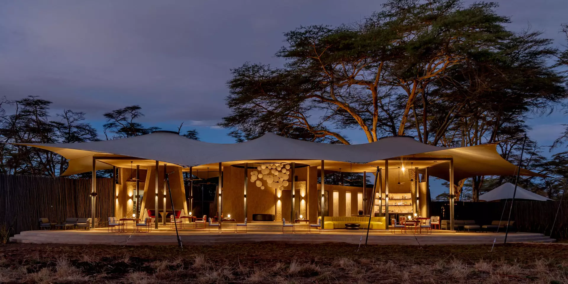 exterior-at-night-angama-amboseli-amboseli-and-the-chyyulu-hills-kenya Inspired by elephants, the design encapsulates Angama's style with the same team's playful touch