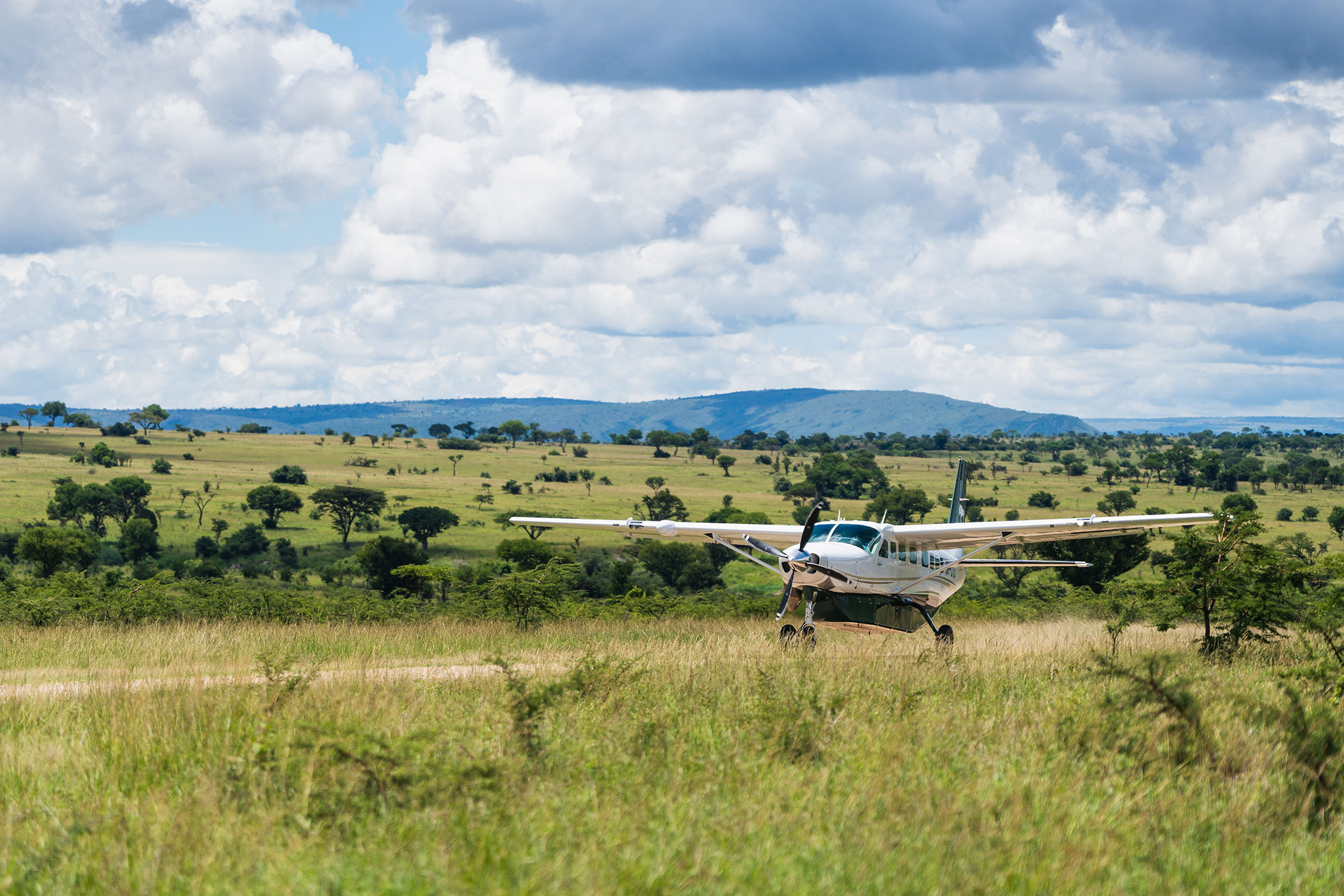 rhino-africa-at-singita-mara-river-tented-camp-copyrights-felix-studios-plane-landscape